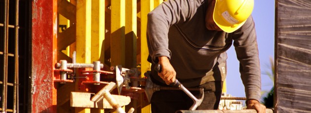 Worker Completing Construction Project